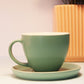 Elegant Green Ceramic Teacup and Saucer Set with Smooth Finish.