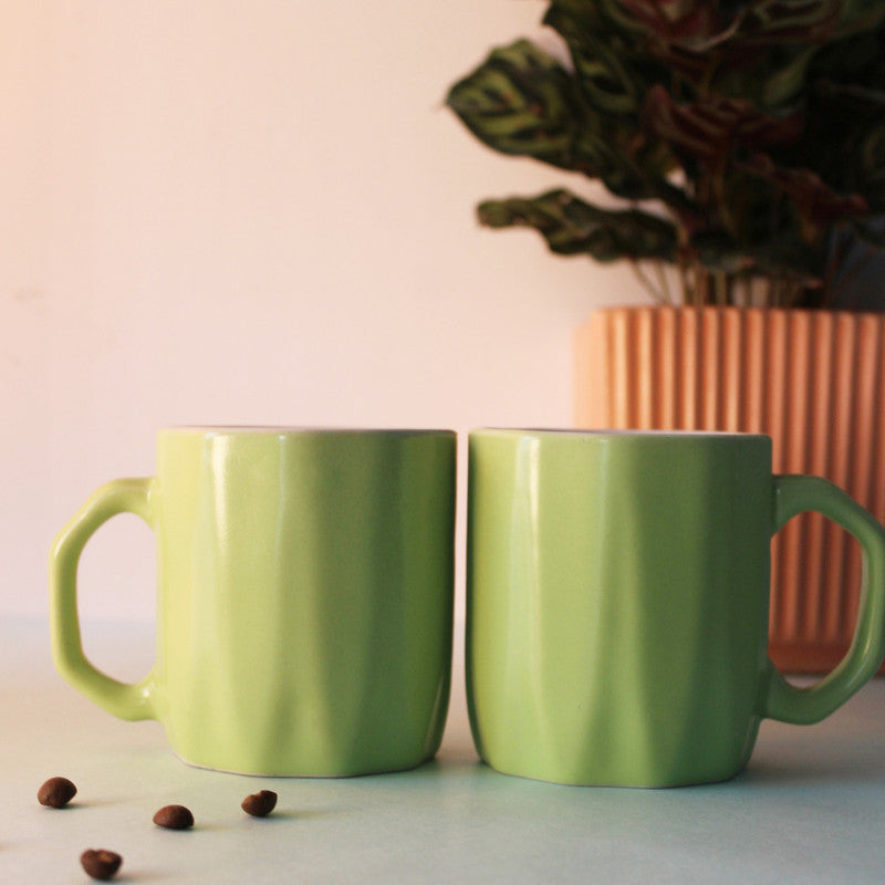 Contemporary Green Ceramic Mugs with Unique Angled Handles.