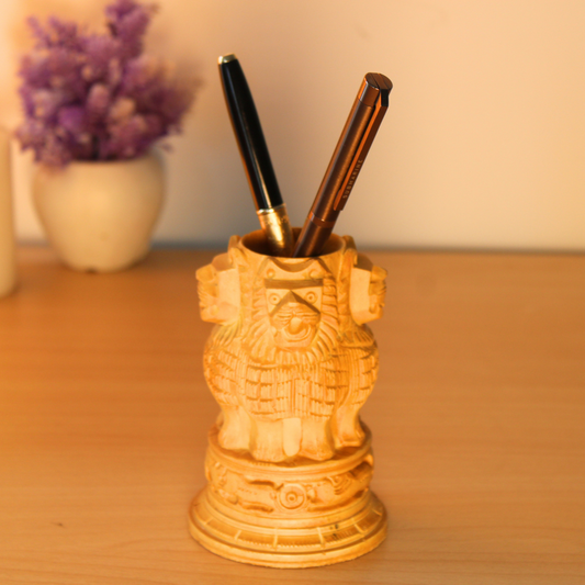 Hand-Carved Wooden Pen Holder with Intricate Lion Design.