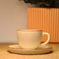 Vintage Cream Ceramic Teacup and Saucer Set with Brown Rim Accent.
