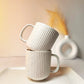 Minimalist Ribbed Ceramic Mugs with Speckled Finish.