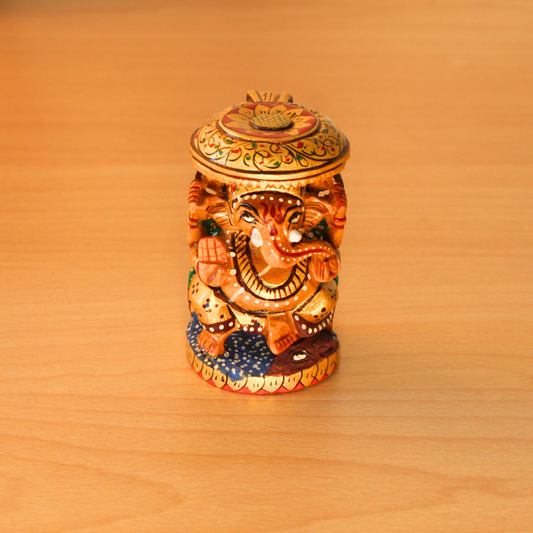 Hand-Painted Wooden Ganesha Figurine with Intricate Detailing.