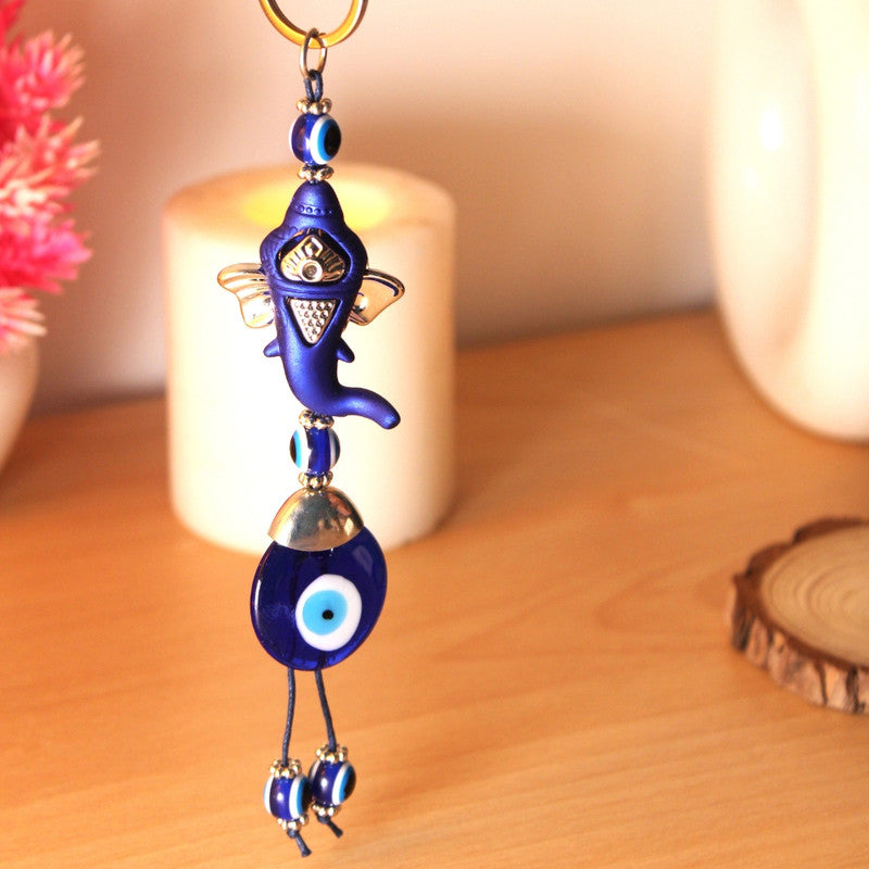 Blue Evil Eye Hanging Ornament with Fish and Bead Accents.